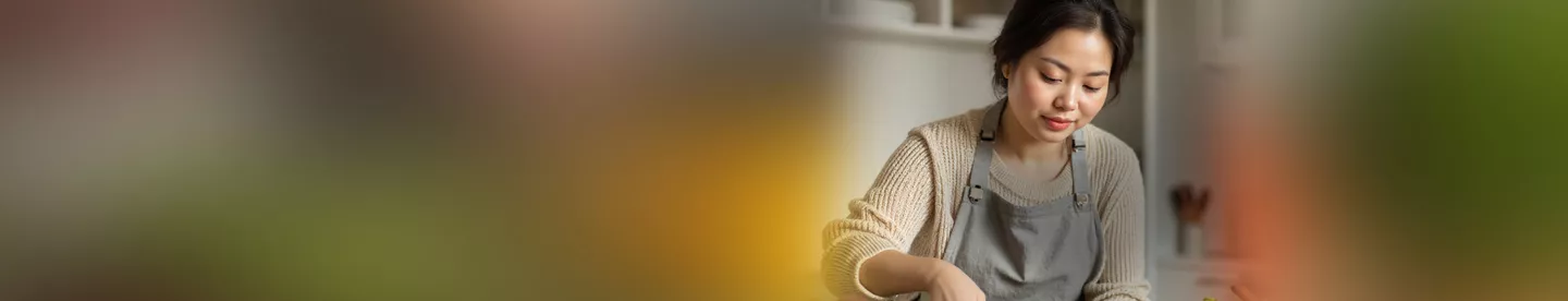 Woman chopping vegetables in the kitchen