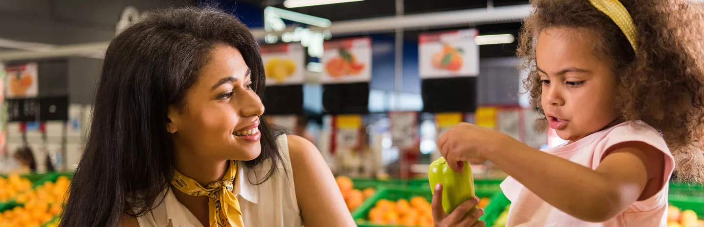 mother and daughter grocery shopping