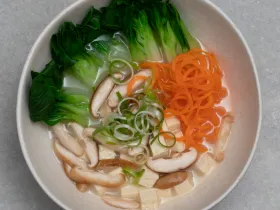 bowl filled with vegies sitting in miso broth
