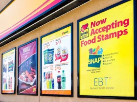 Exterior signage at a convenience store; closeup for SNAP (food stamps)