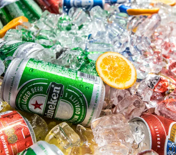 Cans of beer on ice.