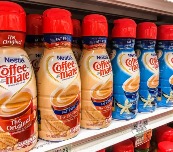 grocery store shelf of coffee mate coffee creamers
