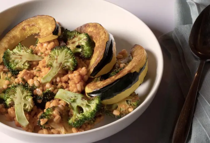 grains, broccoli, and other vegetables in white bowl