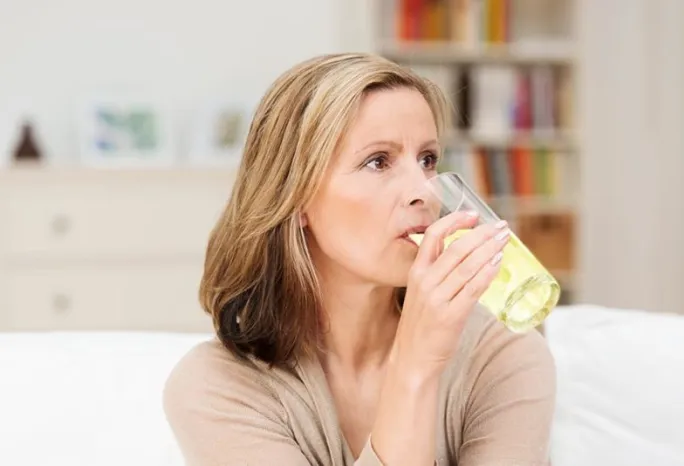 woman drinking beverage