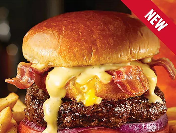 cheeseburger topped with mac n' cheese