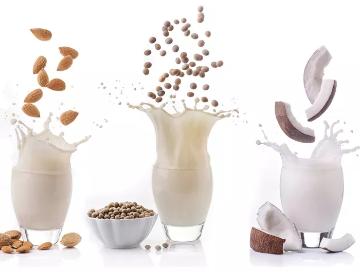 various milks splashing in cup