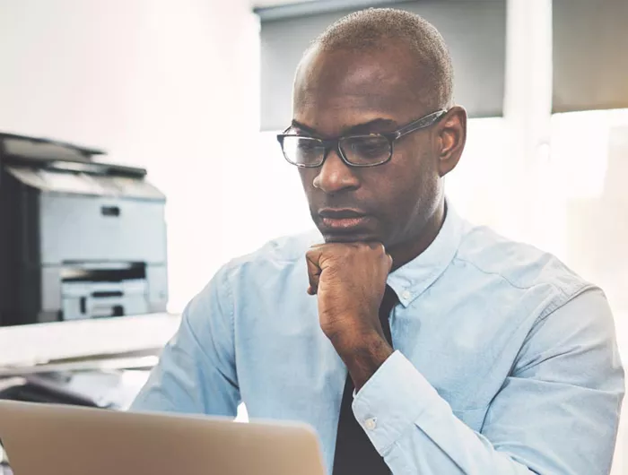 man looking at computer screen