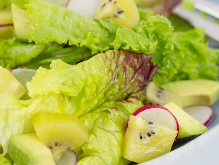 salad with lettuce, kiwi, avocado, and radish