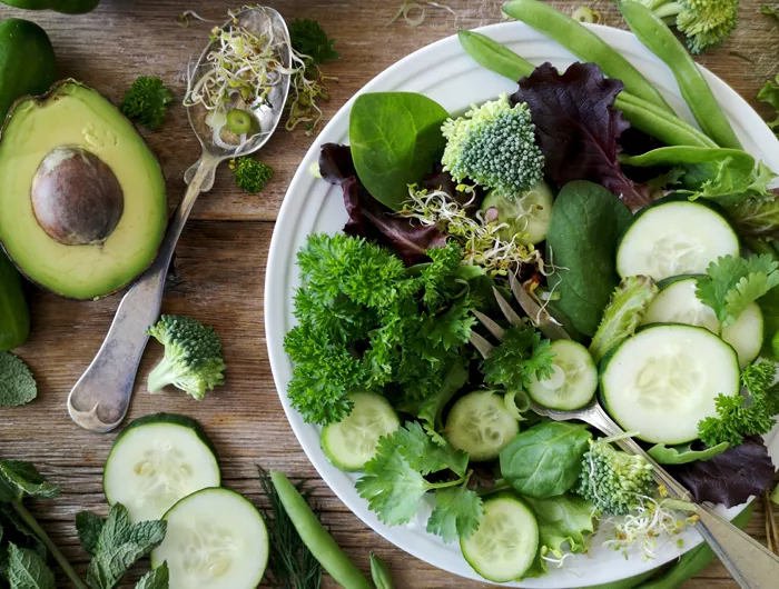a salad full of green vegetables