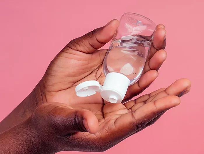 hands applying sanitizer