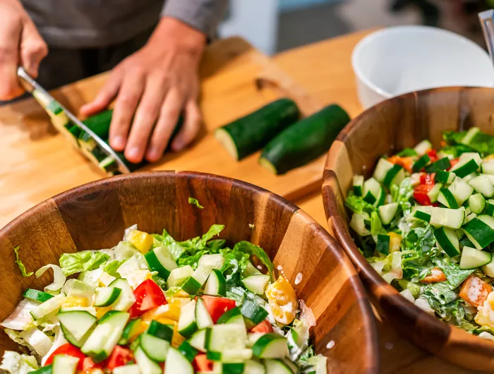 a man cutting vegetables
