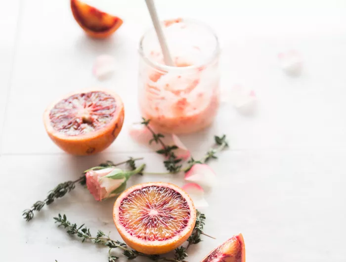 Pink smoothie, grapefruit, pink flowers
