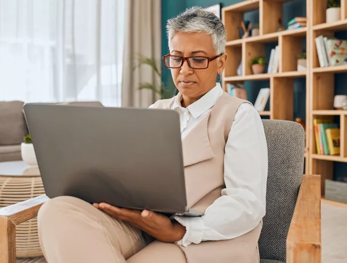 woman looking at laptop