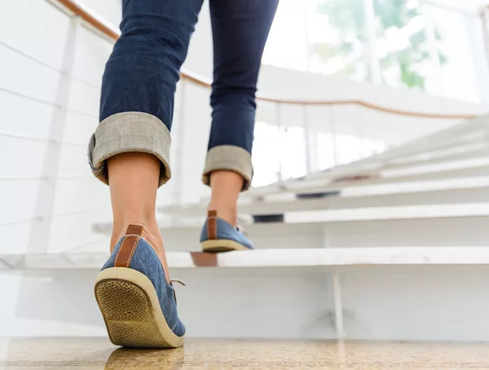 feet of a person climbing the stairs