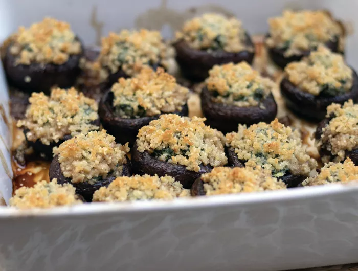 metal pan filled with stuffed mushrooms