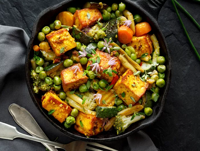 skillet filled with vegetables and tofu