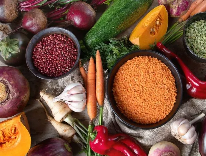 An assortment of fall produce, healthy grains, and dry legumes and lentils