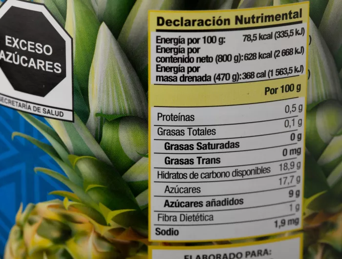 Food label warning about excess added sugars in a can of food
