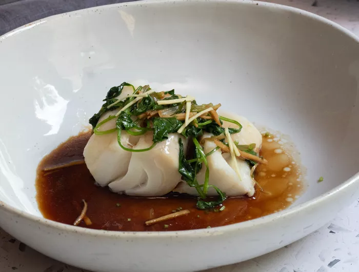 bowl with cod in sauce