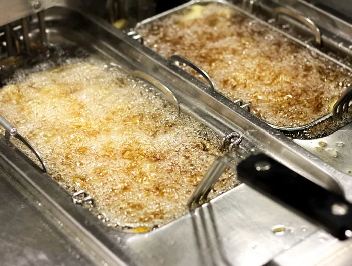 fryer with bubbling oil inside