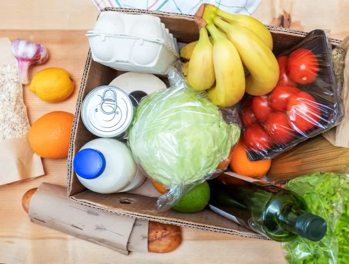 A box of perishable and non-perishable food items for donation
