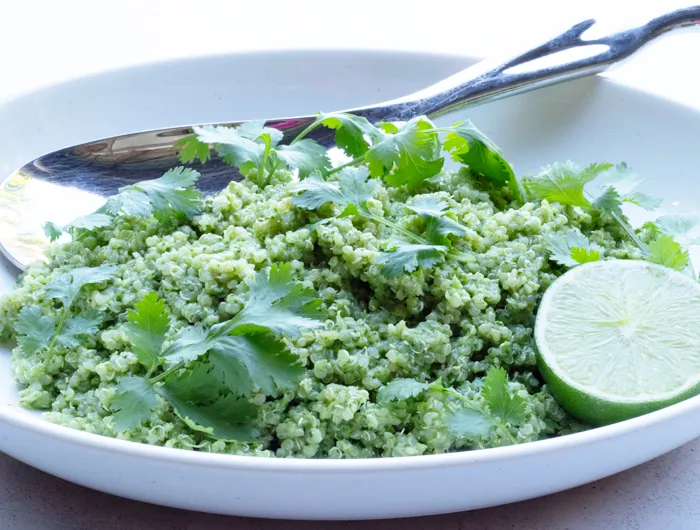 white bowl with cilantro and lime quinoa