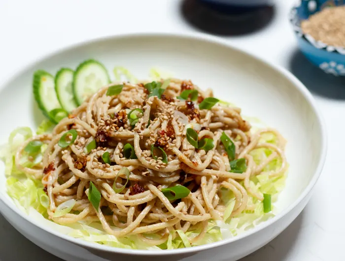 white bowl filled with sesame noodles