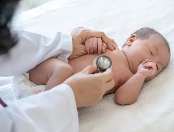 doctor listening to a baby's heart