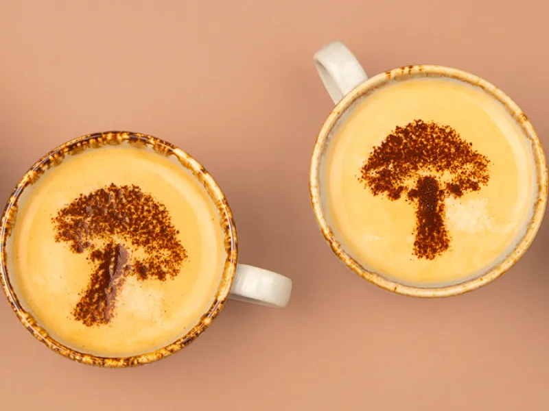 flat lay of mugs with mushroom shaped art