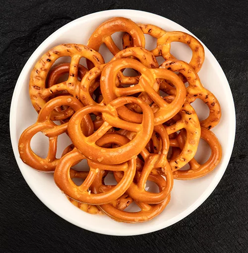 white bowl filled with pretzels