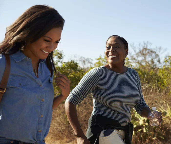 Two women walking. Shoot for a half hour of brisk walking daily to lower your risk of diabetes. And if you have diabetes, get up and move every half hour.