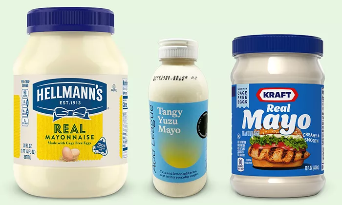 Helman's Real Mayonnaise, Acid League Tangy Yuzu Mayo, Kraft Real Mayo lined up on green background.
