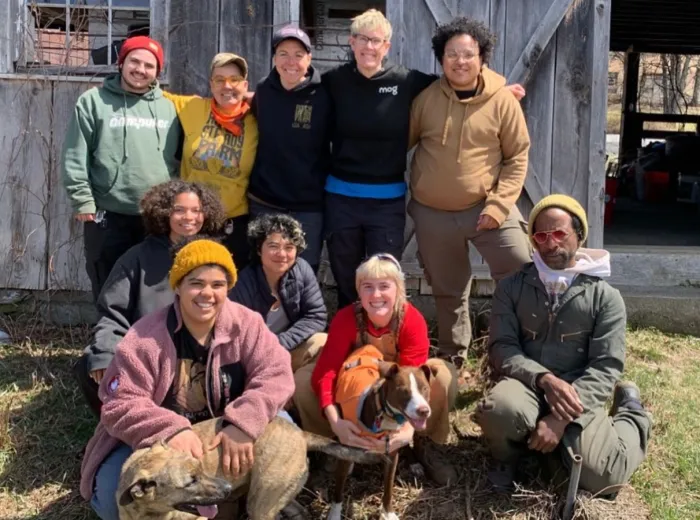 10 Farmers pictured in front of a barn at Rock Steady Farm.
