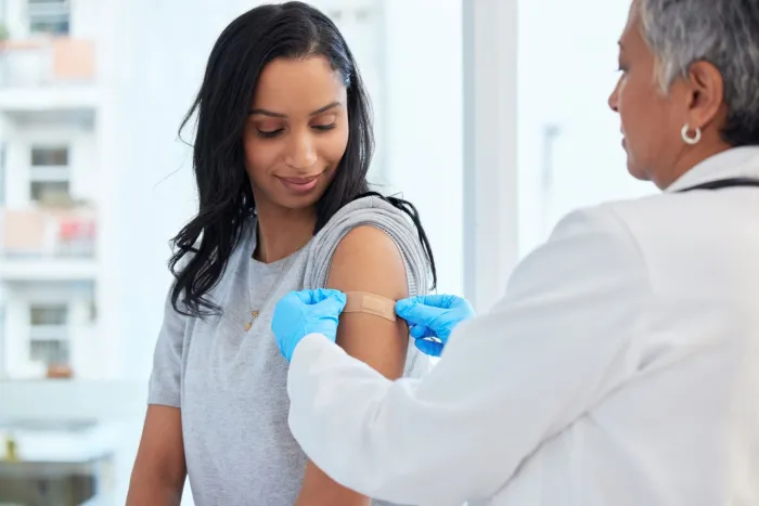 A woman receives a flu shot
