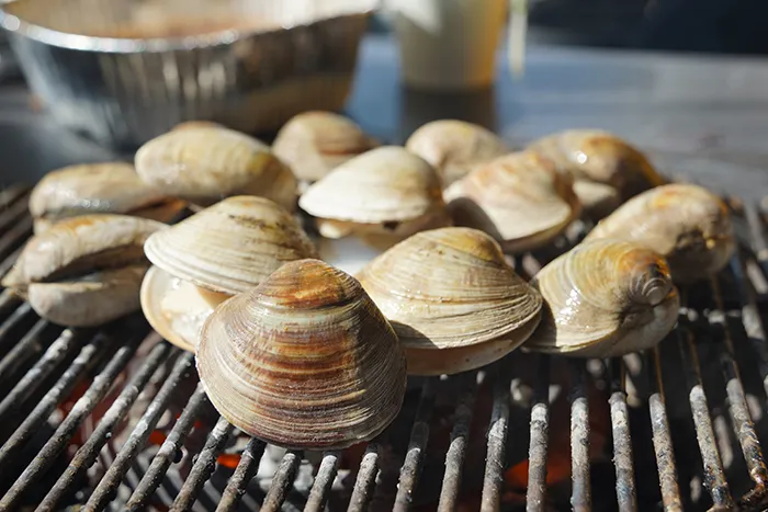 clams cooking on grill
