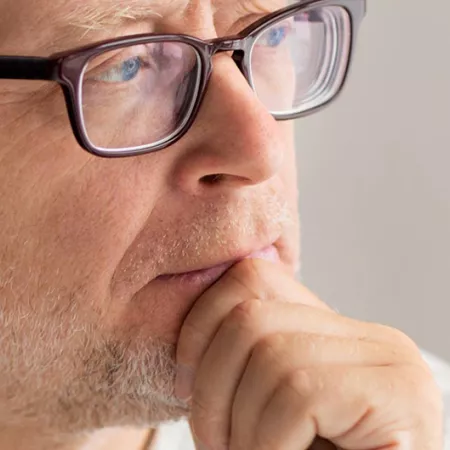 man with hand on chin thinkin