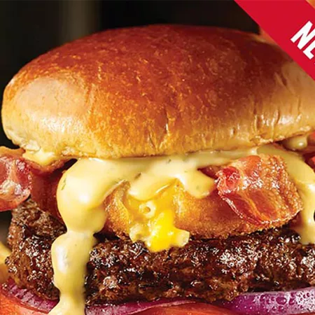 cheeseburger topped with mac n' cheese