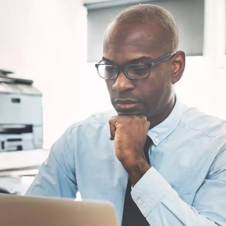 man looking at computer screen