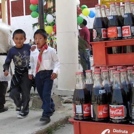 two boys walking past soda