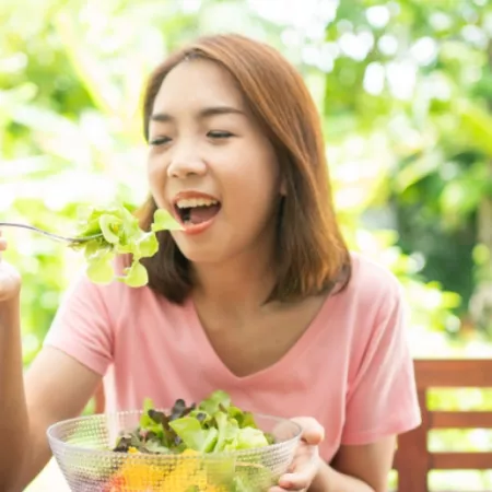 woman eating salad