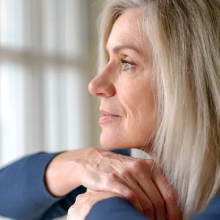 woman looking out the window