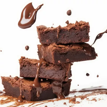 stack of brownies with chocolate syrup splatters