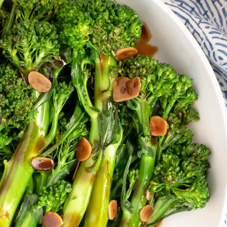 plate of broccolini in garlic sauce