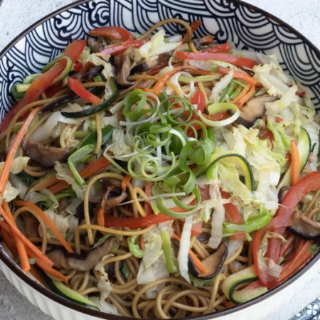 bowl of noodles and cut vegetables