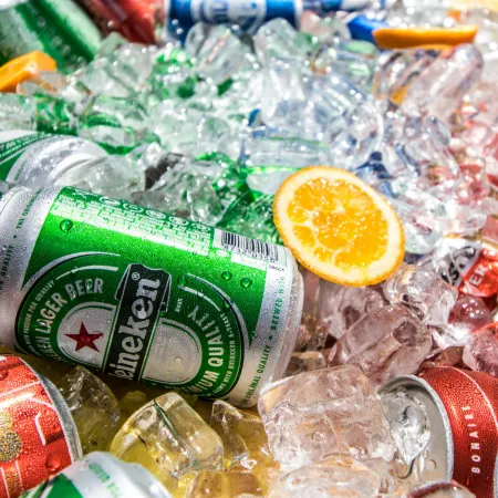 Cans of beer on ice.