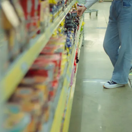 Person browsing packaged foods.