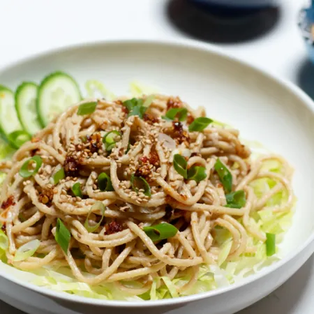 white bowl filled with sesame noodles